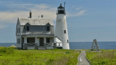 a castle on top of a lush green field