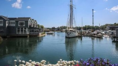 a boat is docked next to a body of water