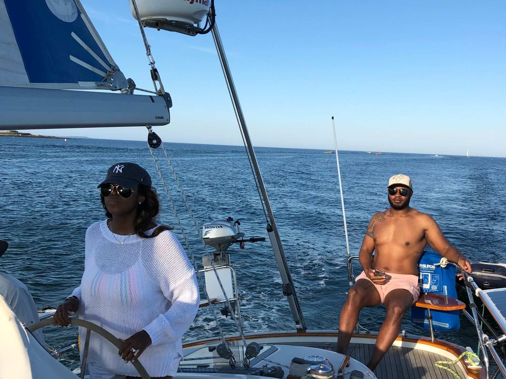 a group of people in a boat on a body of water