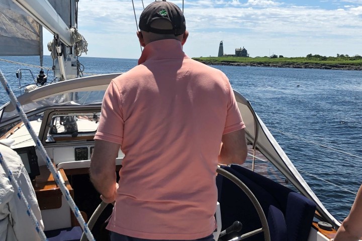 a man and a woman sitting on a boat in a body of water