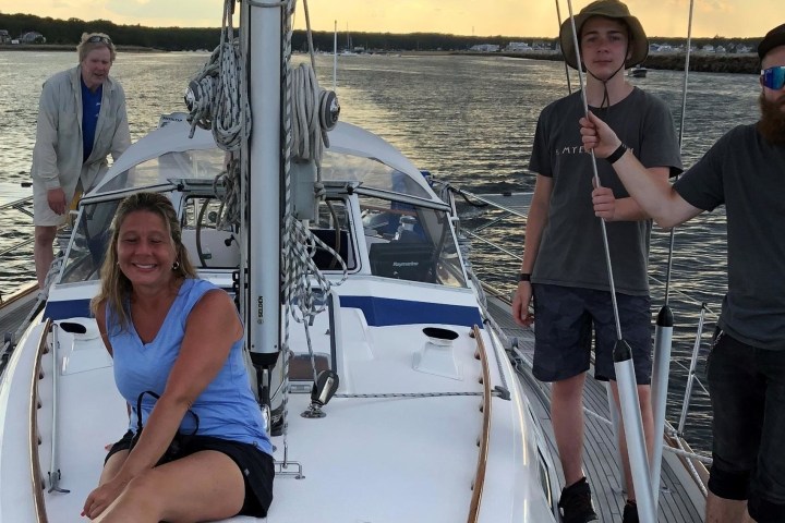 a couple of people standing on a boat