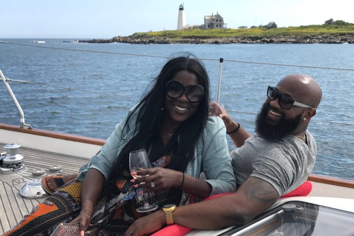 a woman sitting on a boat in a body of water