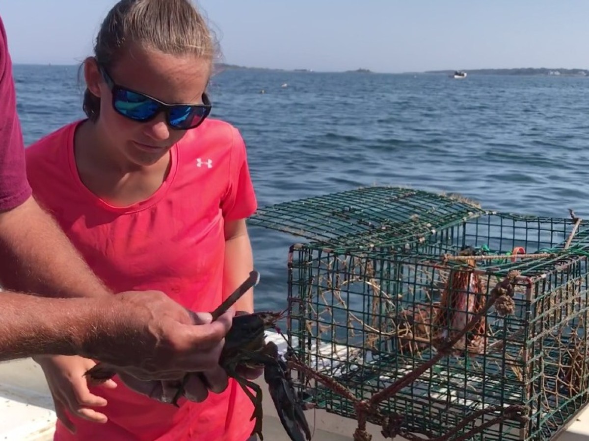 a man standing on a boat in the water