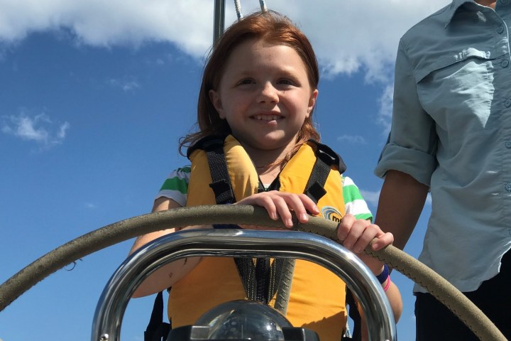 a young boy wearing a helmet
