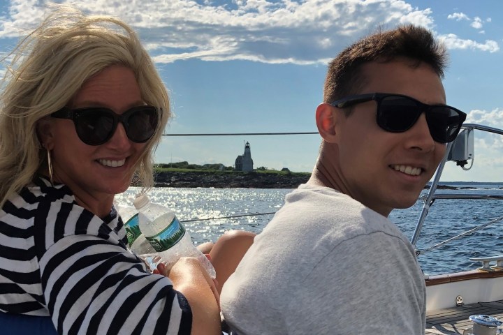 a woman wearing sunglasses taking a selfie