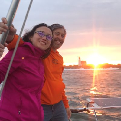 a person standing in front of a sunset