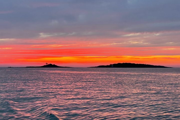 a sunset over a body of water