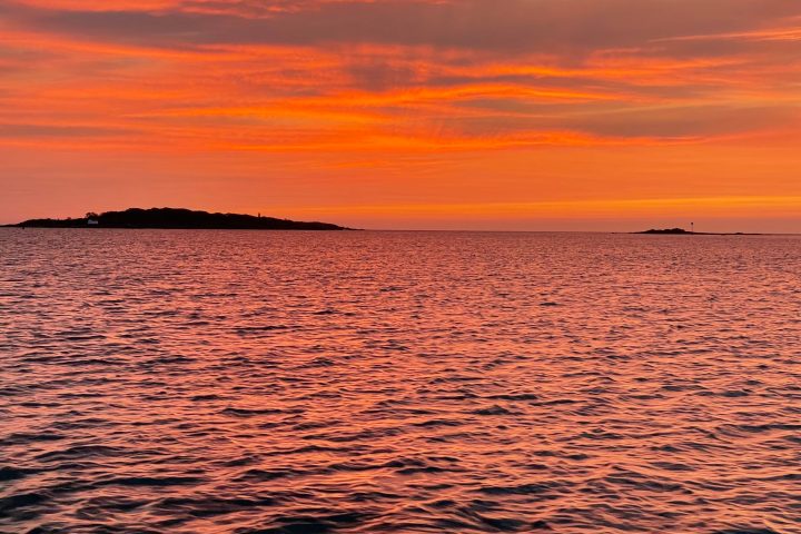 a sunset over a body of water