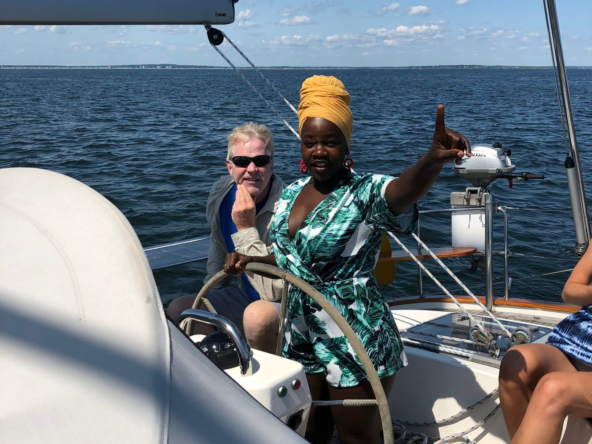 a group of people in a boat on a body of water