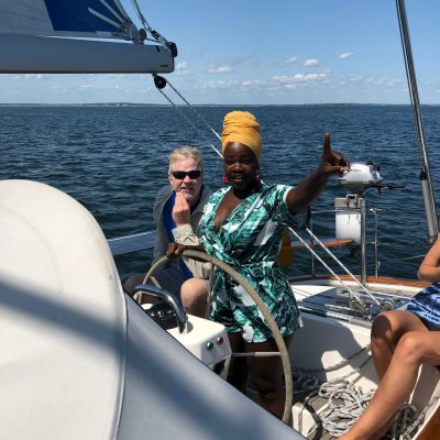 a group of people in a boat on a body of water