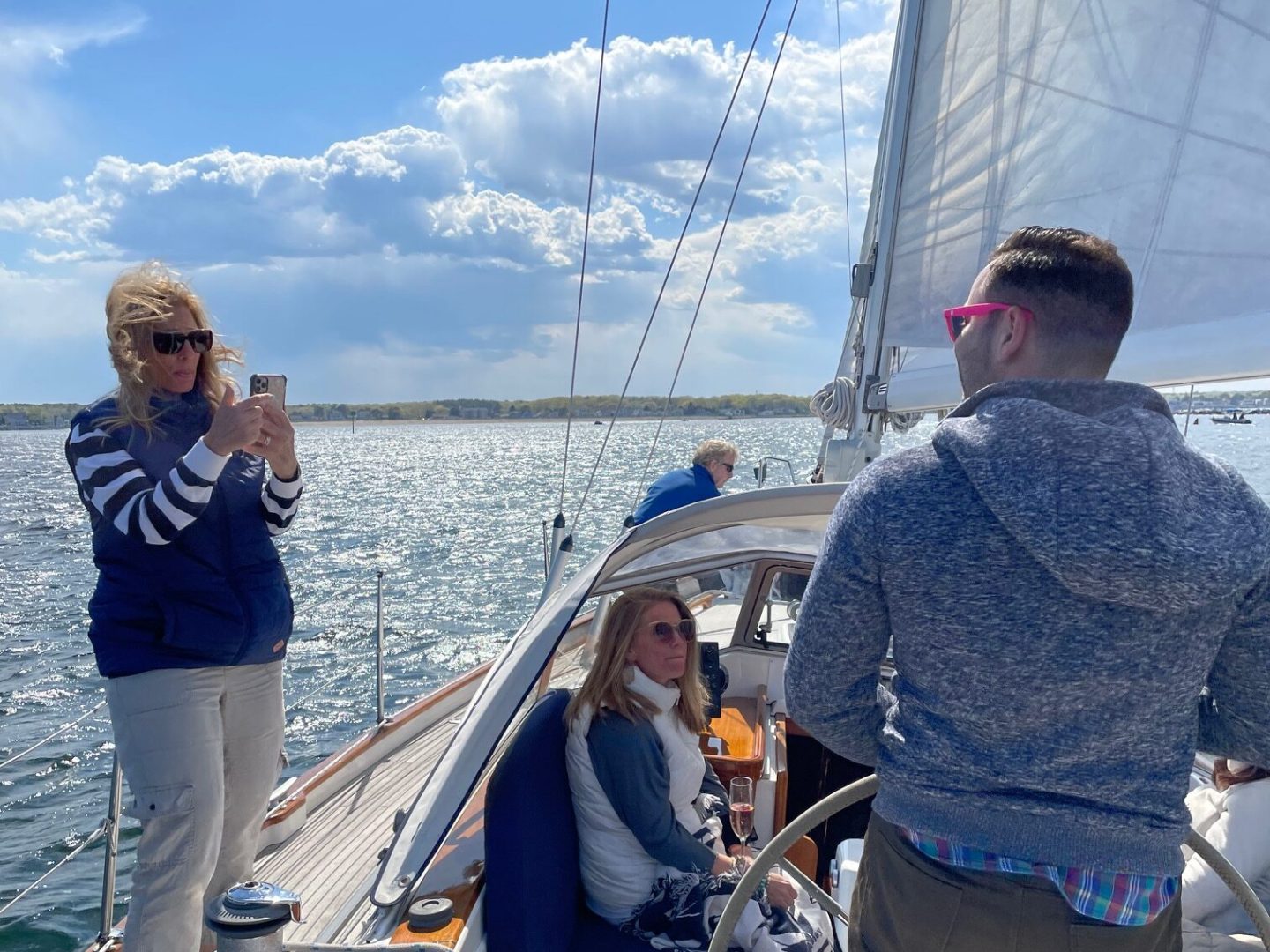 a group of people standing on a boat