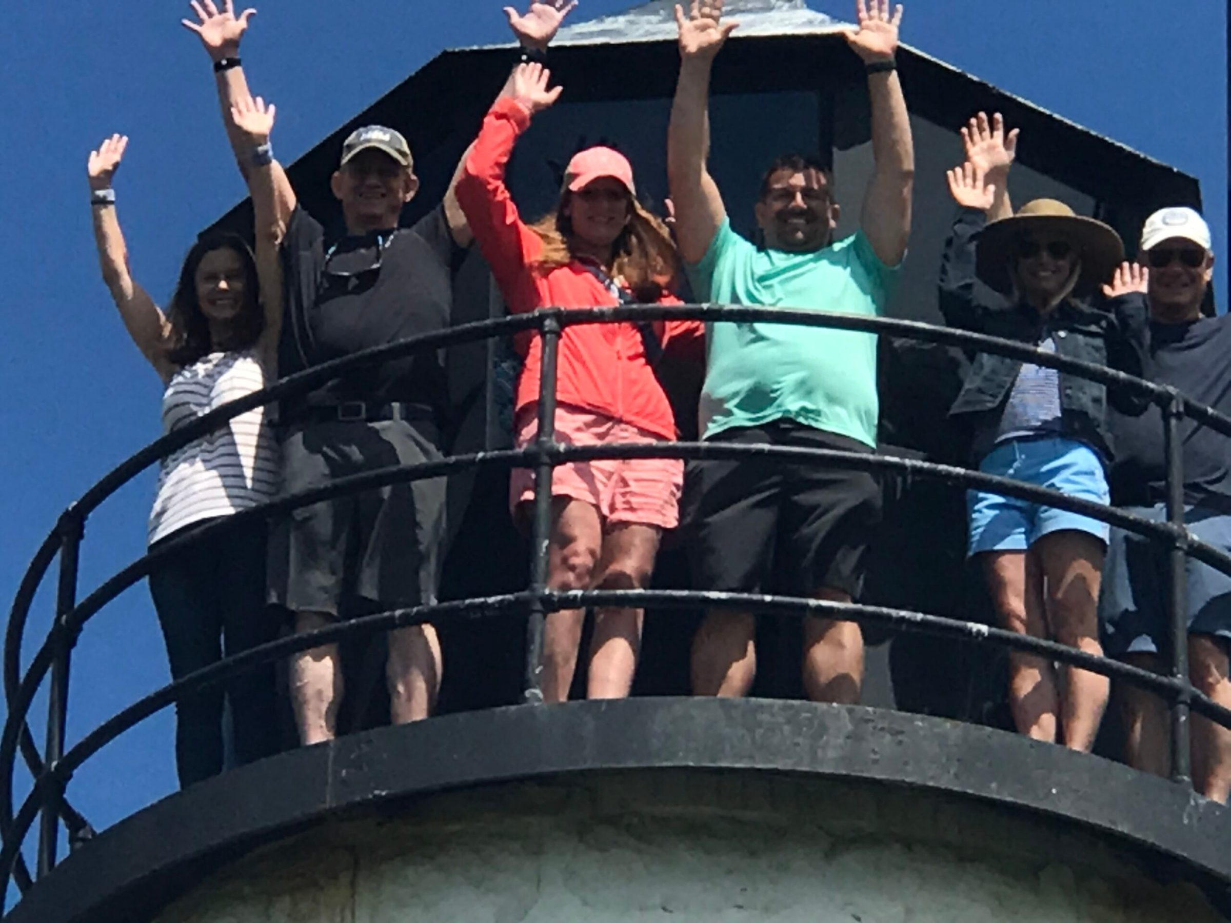 a group of people riding on the back of a boat