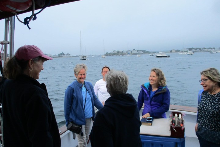 Elizabeth Jones et al. standing next to a body of water