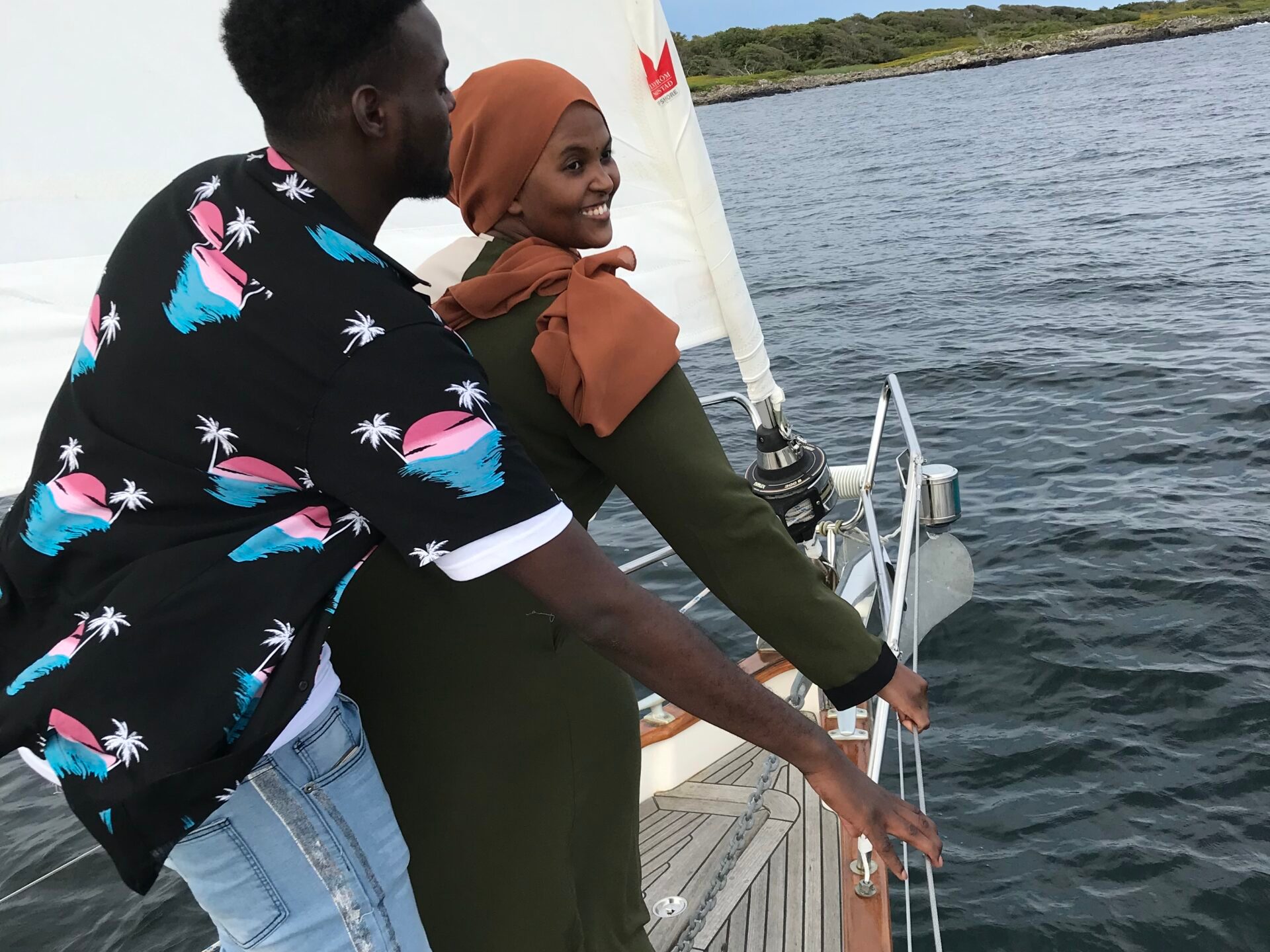 a person standing next to a body of water