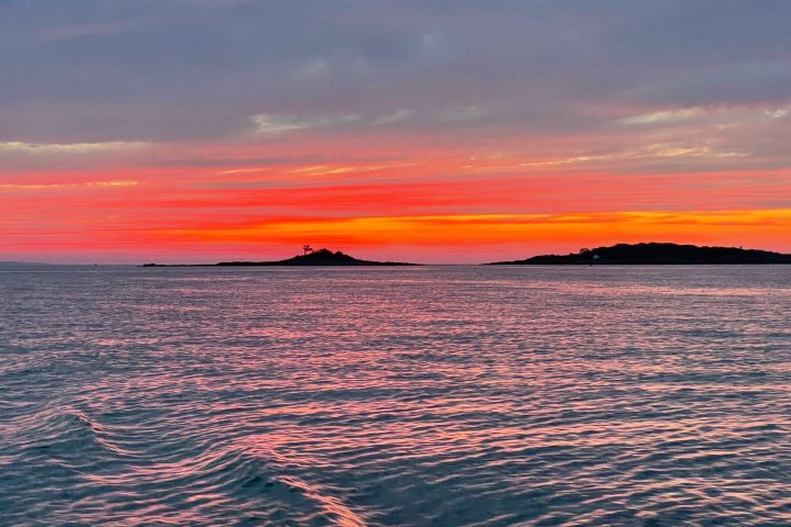 a sunset over a body of water