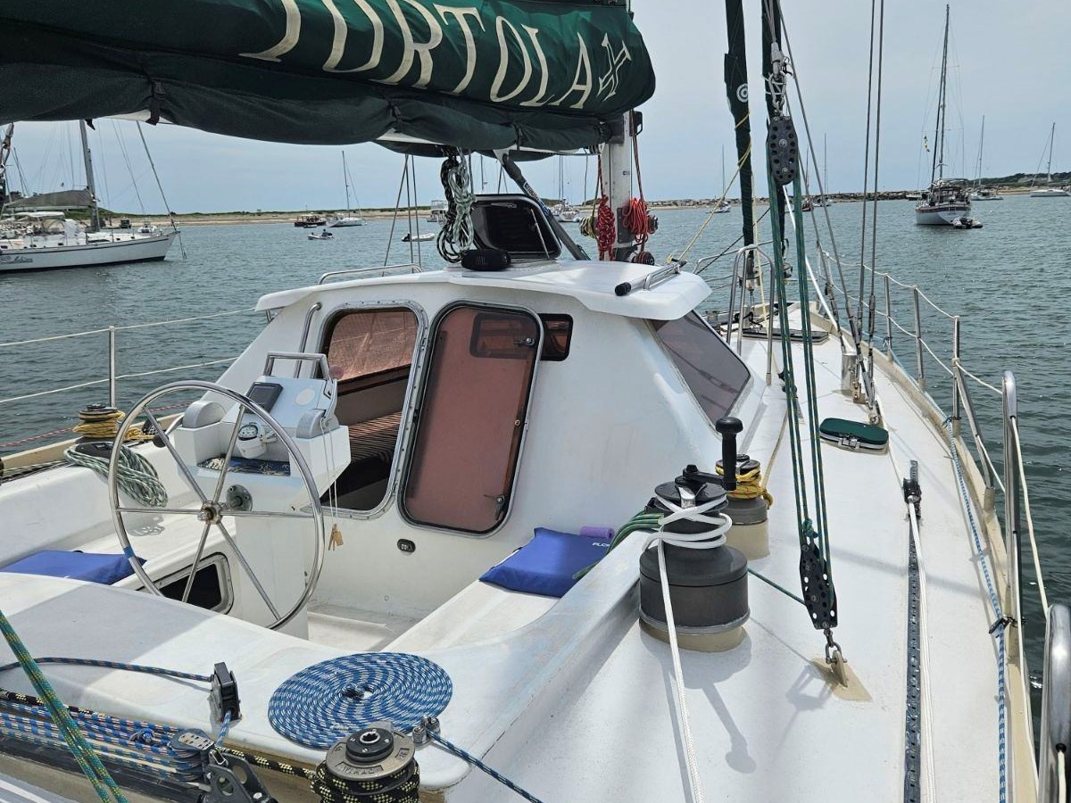 a boat is docked next to a body of water