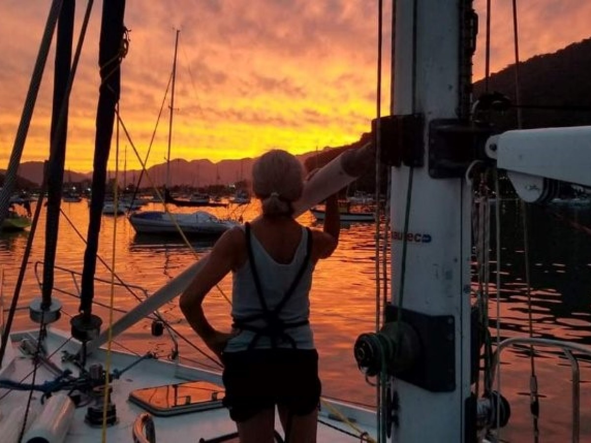 a person standing in front of a boat