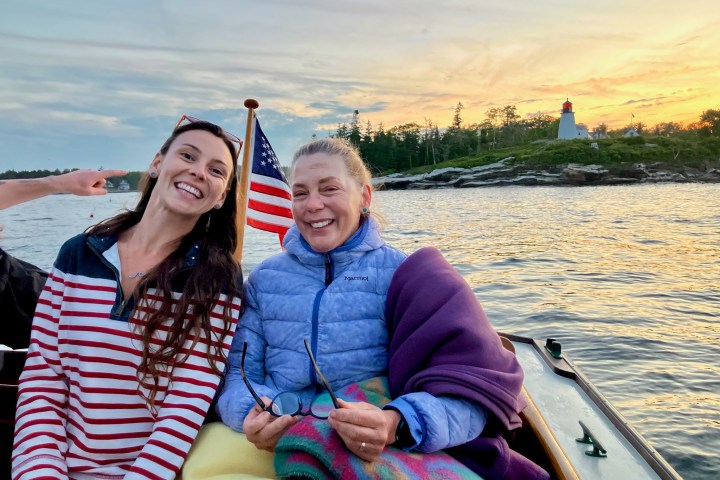 a person sitting on a boat in a body of water