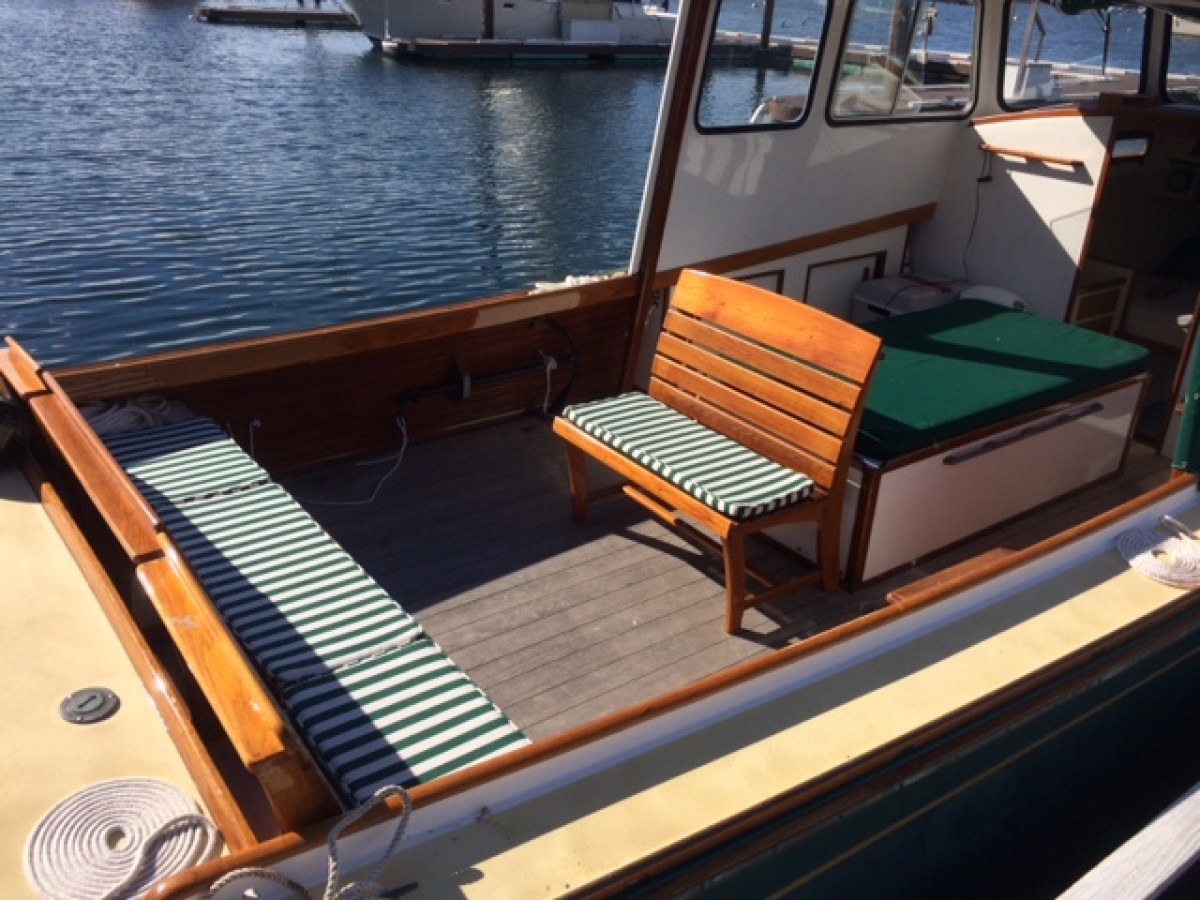 a boat sitting on top of a wooden chair