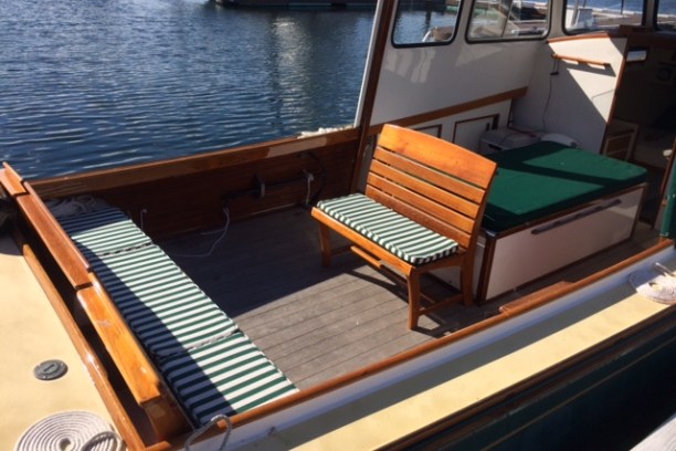 a boat sitting on top of a wooden chair