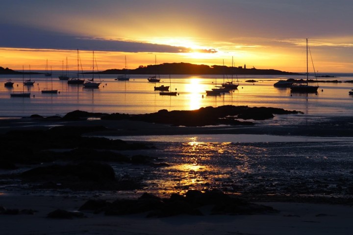 a sunset over a body of water