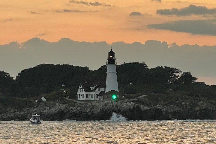 a body of water with a mountain in the background