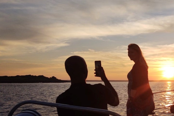 a couple of people that are standing in a body of water