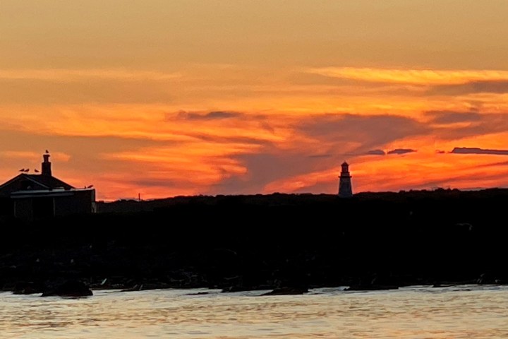 a sunset over a body of water