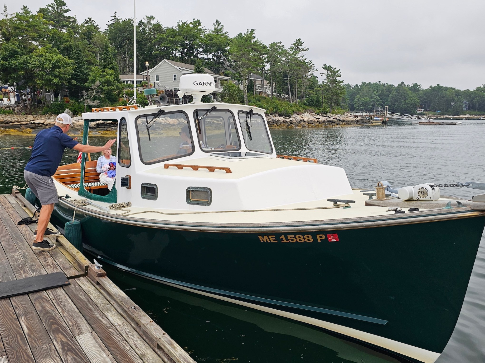 a boat is docked next to a body of water